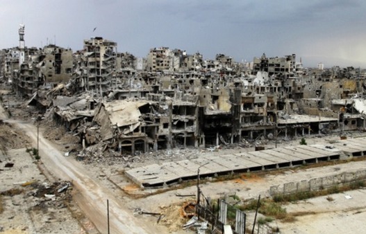 Homs au mois de mai quand un accord négocié par l'Iran a permis aux combattants anti-Assad de la quitter, avec une poignée de non combattants qui ont survécu au siège pendant 2 ans. Photographe : Reuters.