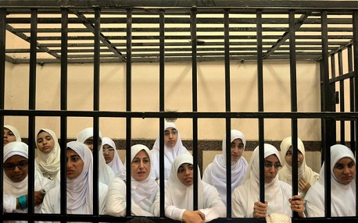 Women supporters of ousted President Mohammed Morsi inside the defendants' cage in a courtroom in Alexandria (FILE) Photo: AP